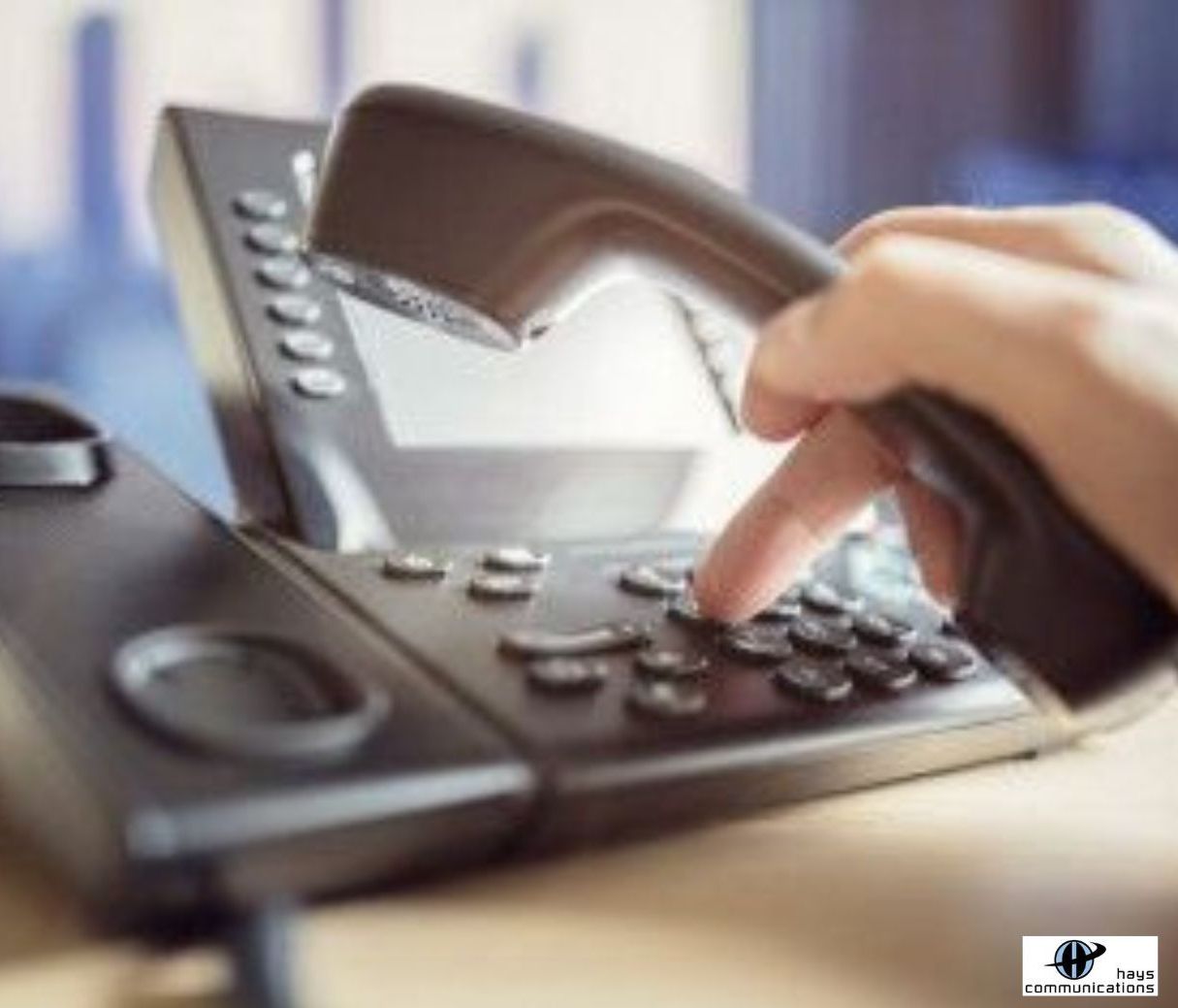 Lubbock office worker dials the telephone