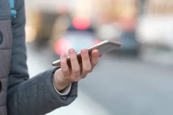 A man holding a cellular phone