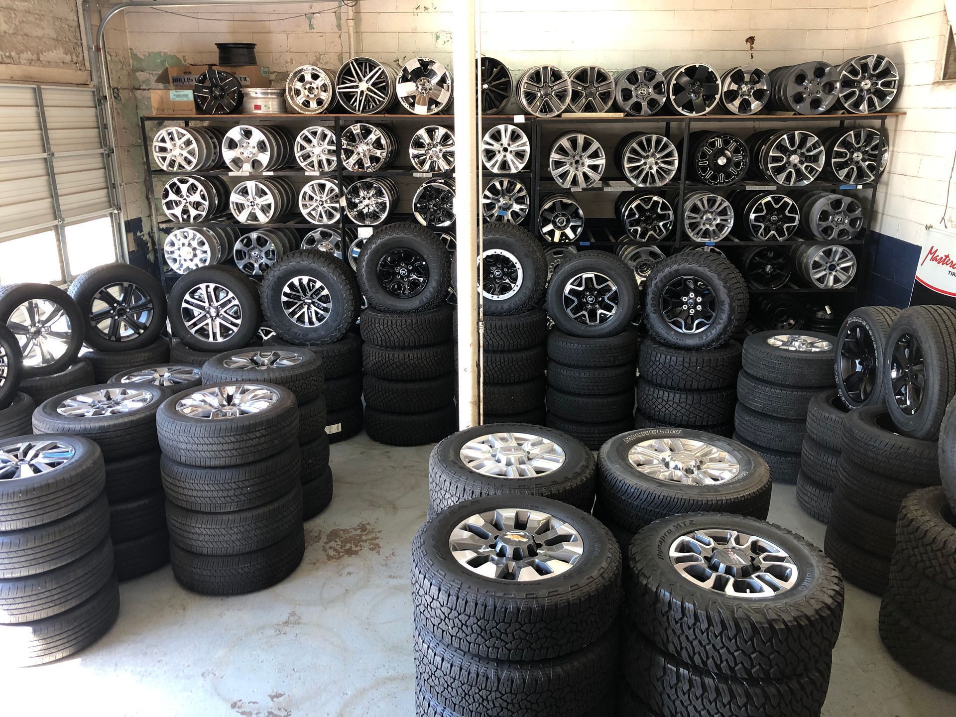 A room filled with lots of tires and wheels