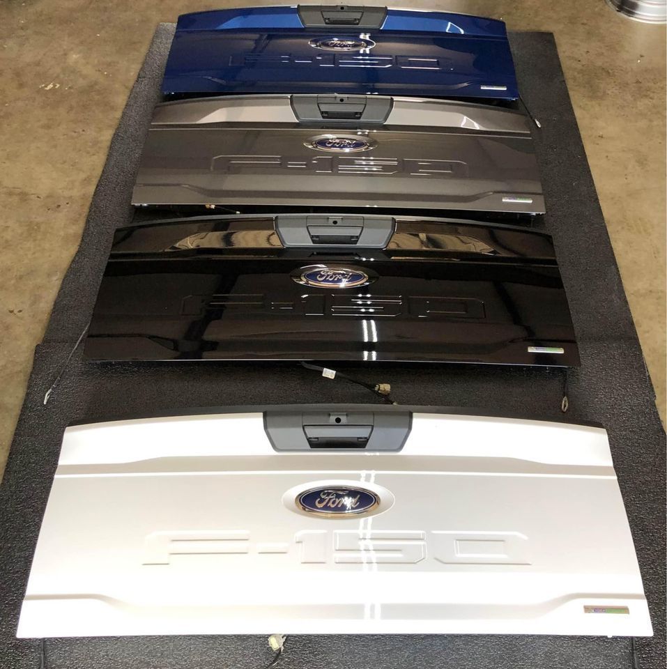 A row of ford tailgate covers in different colors