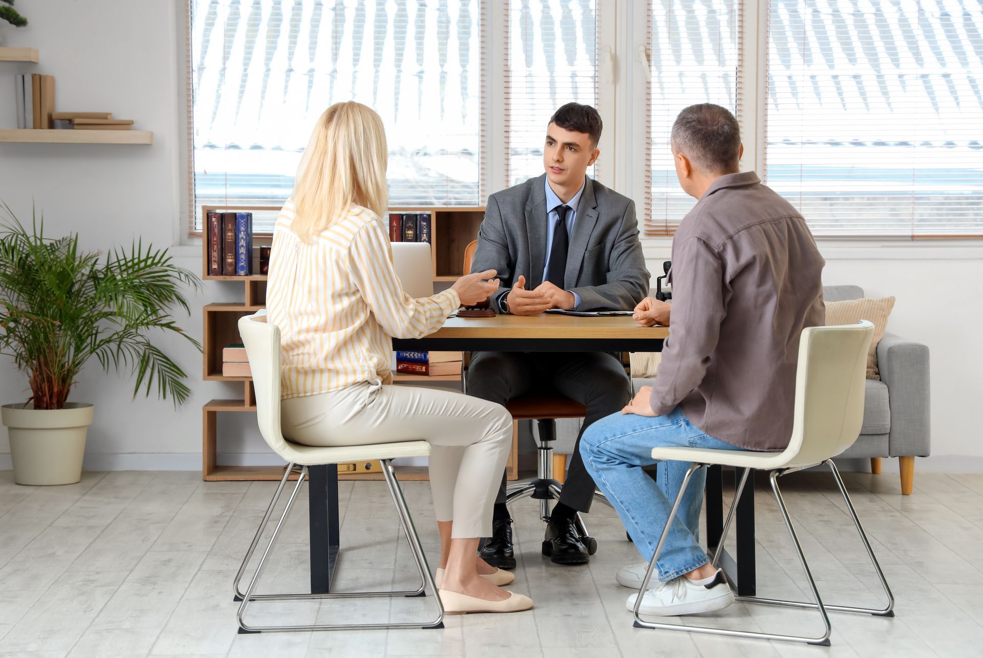 A couple is talking to a lawyer.