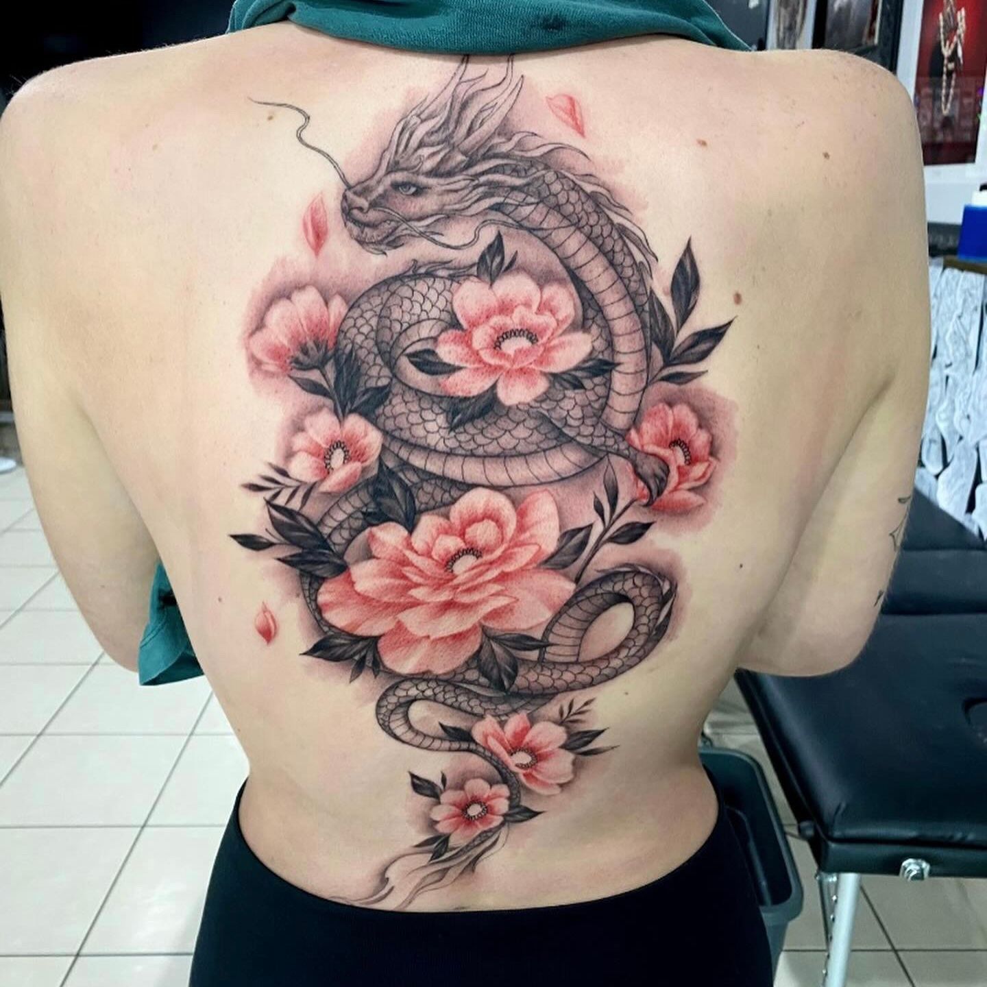 Floral Sleek Serpent Tattoo