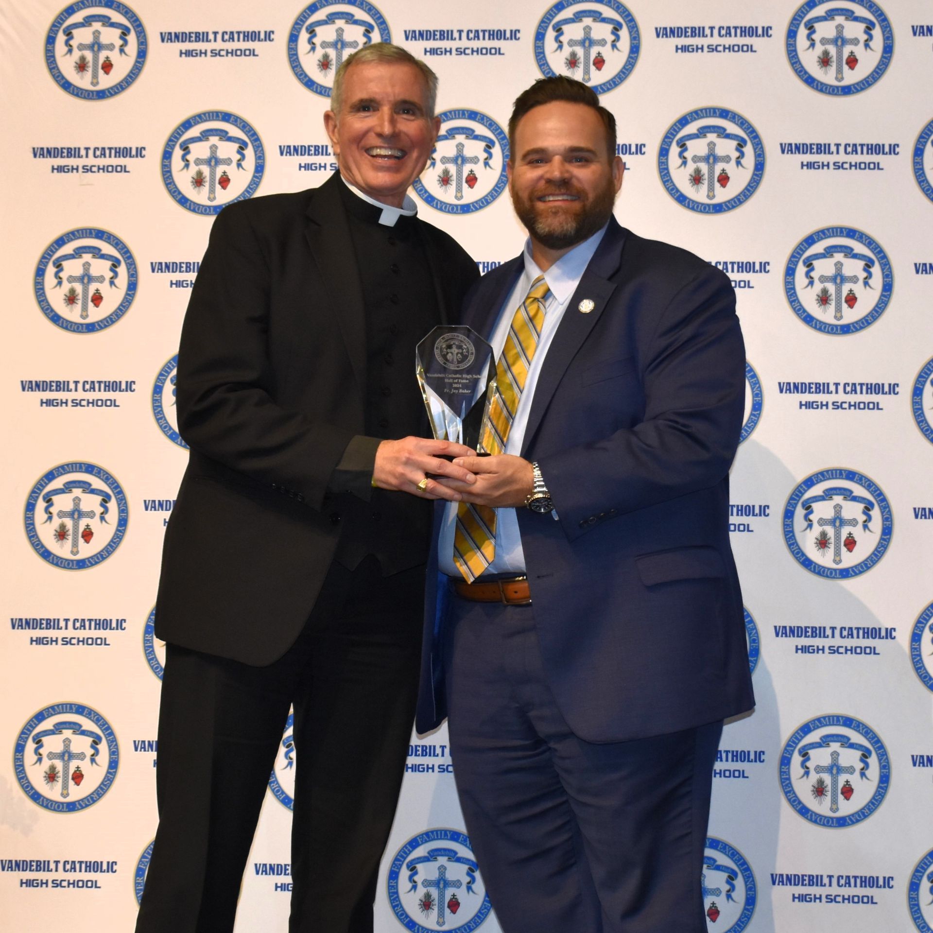 <p class="rteBlock"><strong>Father Jay Baker accepts the 2024 Hall of Fame Induction award.</strong></p>