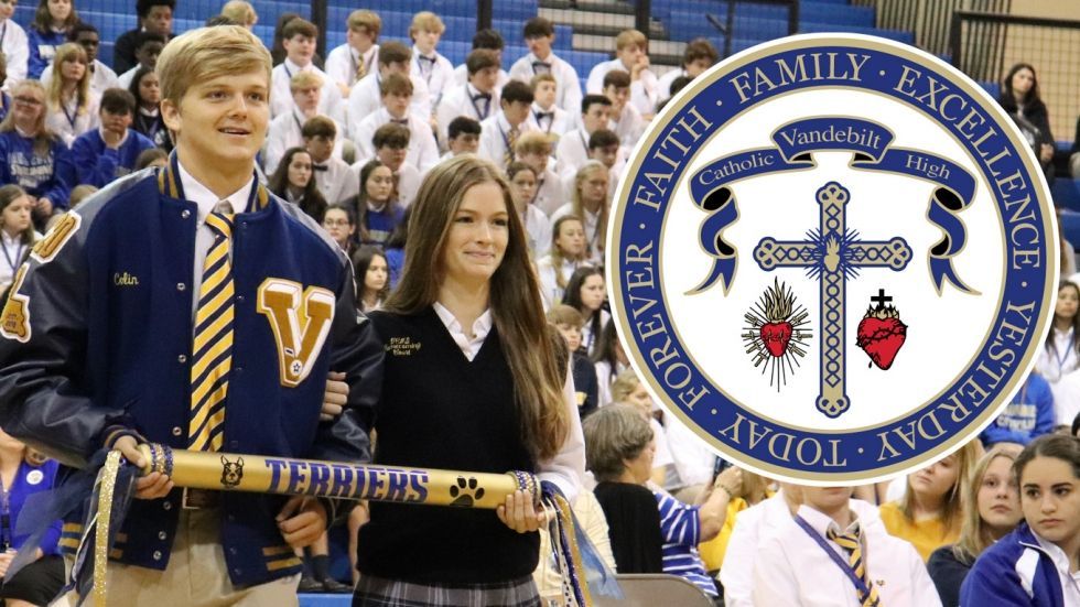 A boy and a girl are walking in front of a crowd holding a sign that says forever faith excellence yesterday