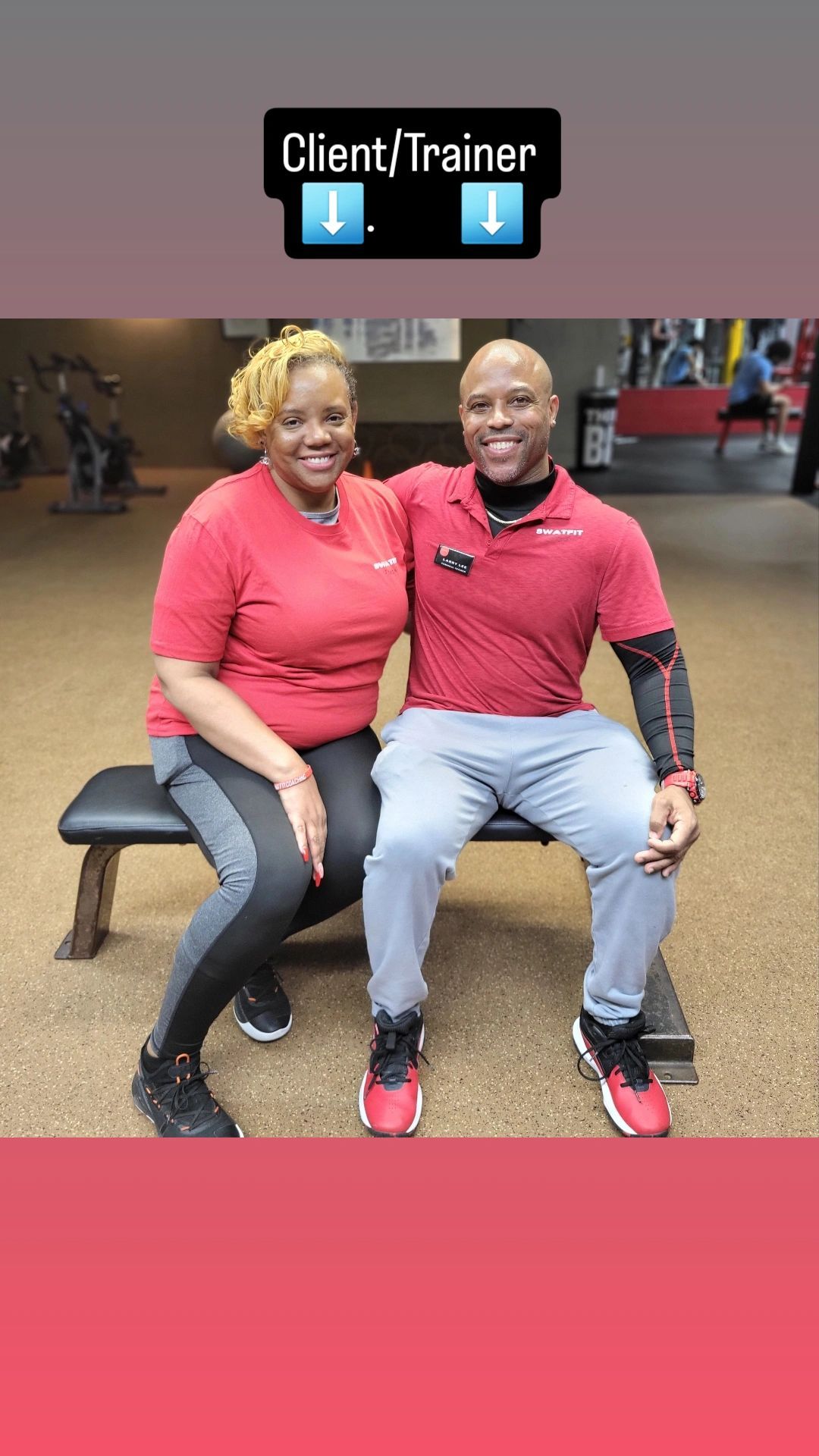 Client and trainer seated on a gym bench, both wearing red shirts. The setting is a gym.