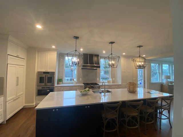 A kitchen with a large island in the middle of it.