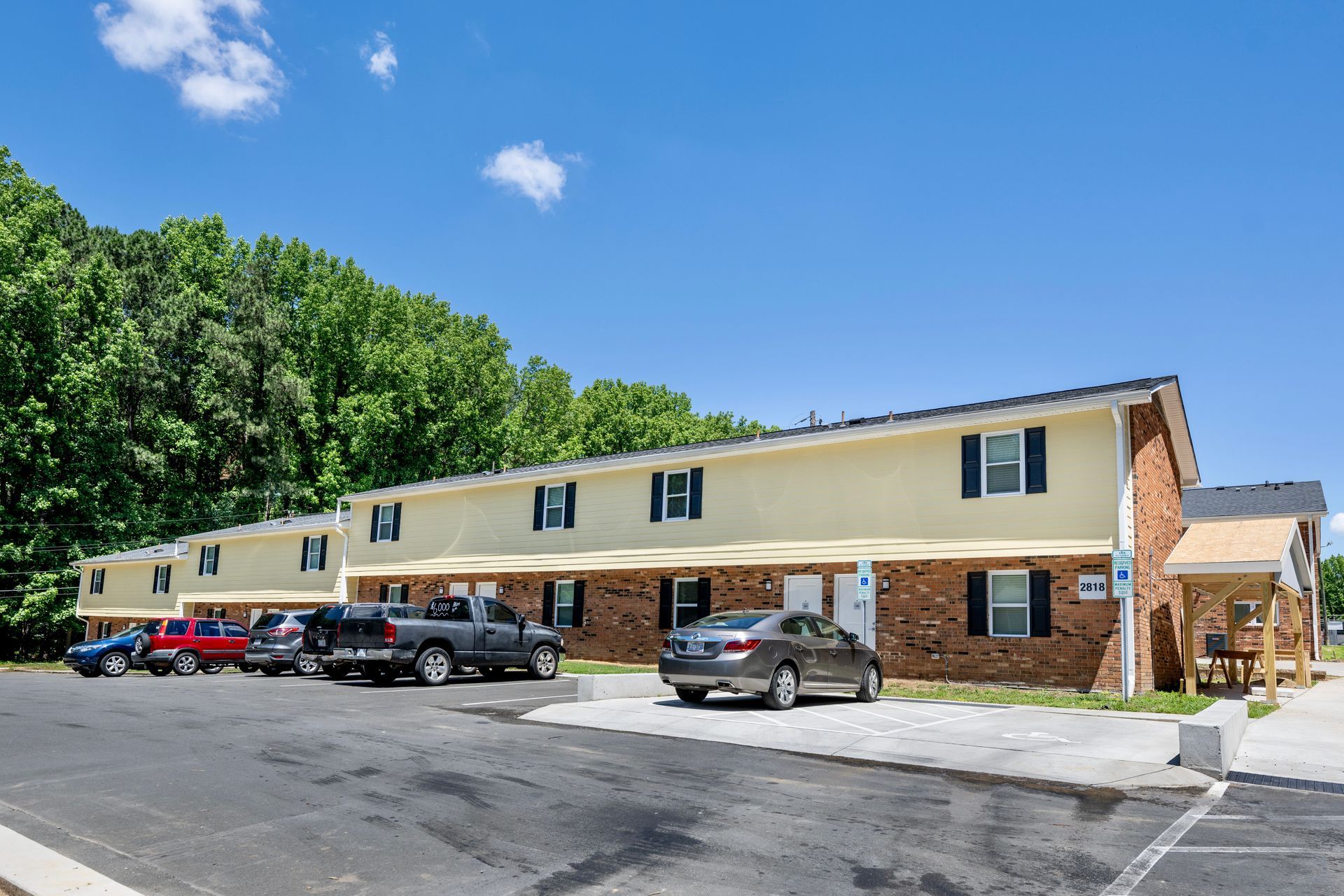 A building with a lot of cars parked in front of it