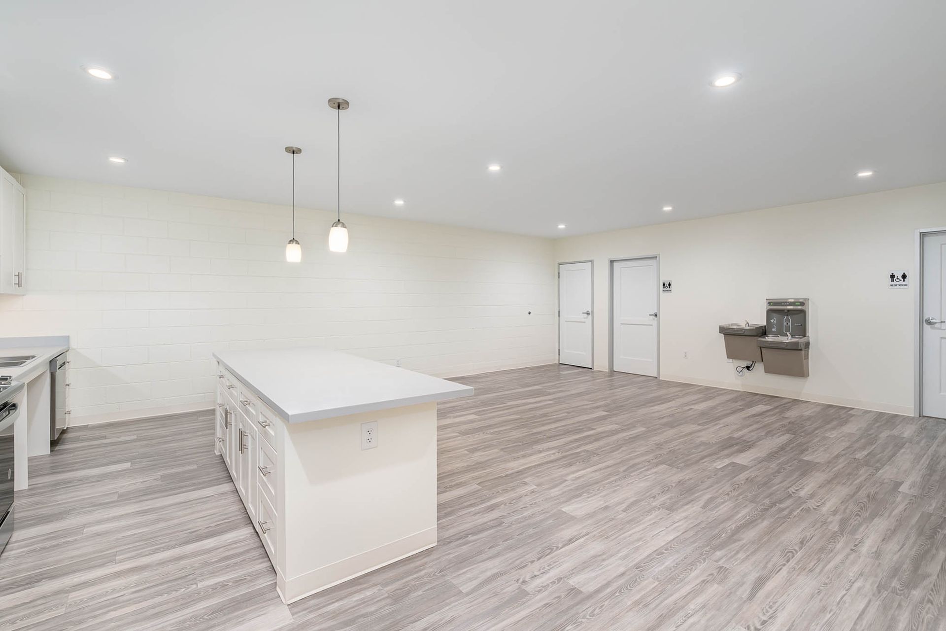 A kitchen with a large island in the middle of the room.