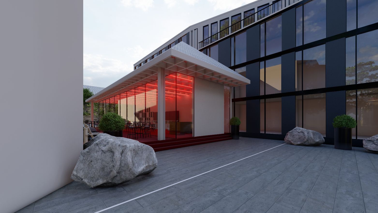 Ein großes Gebäude mit vielen Fenstern und einem roten Dach.