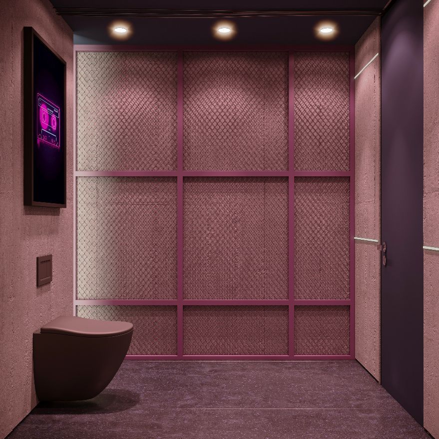 Ein Badezimmer mit rosa Wänden und einer Toilette.