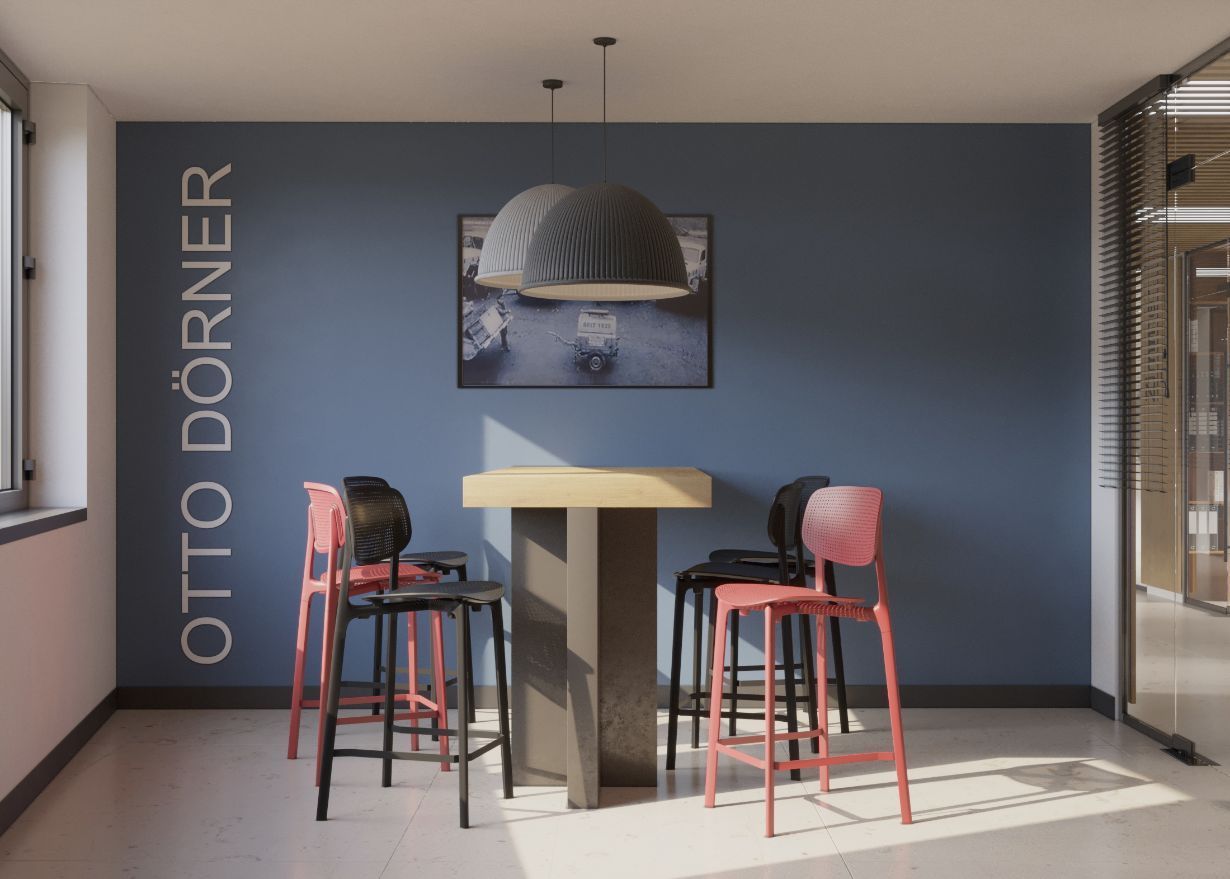 Ein Raum mit einem Tisch und Stühlen mit Otto Dorner an der Wand geschrieben