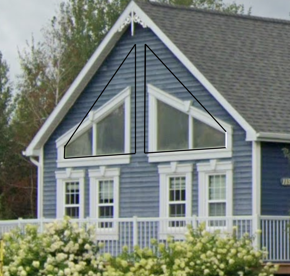 Une maison bleue avec un triangle sur le côté