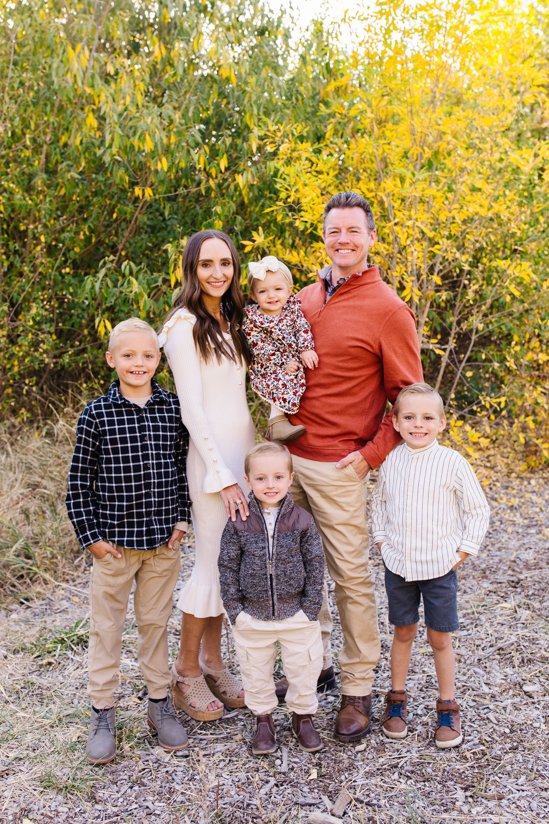 An air conditioner is sitting outside of a brick building.