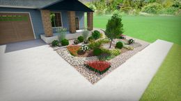 Landscaped front yard with varied plants and river rock bordering a driveway.