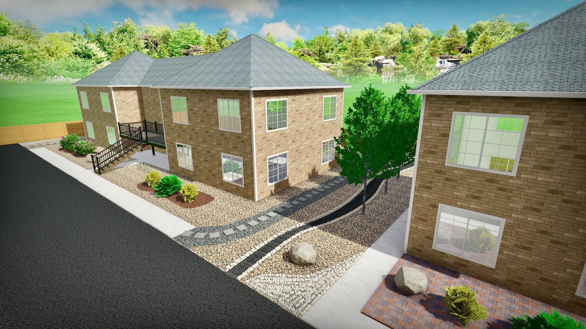 Two-story brick buildings with a landscaped area, including a rock-lined drainage channel, trees, and shrubs.