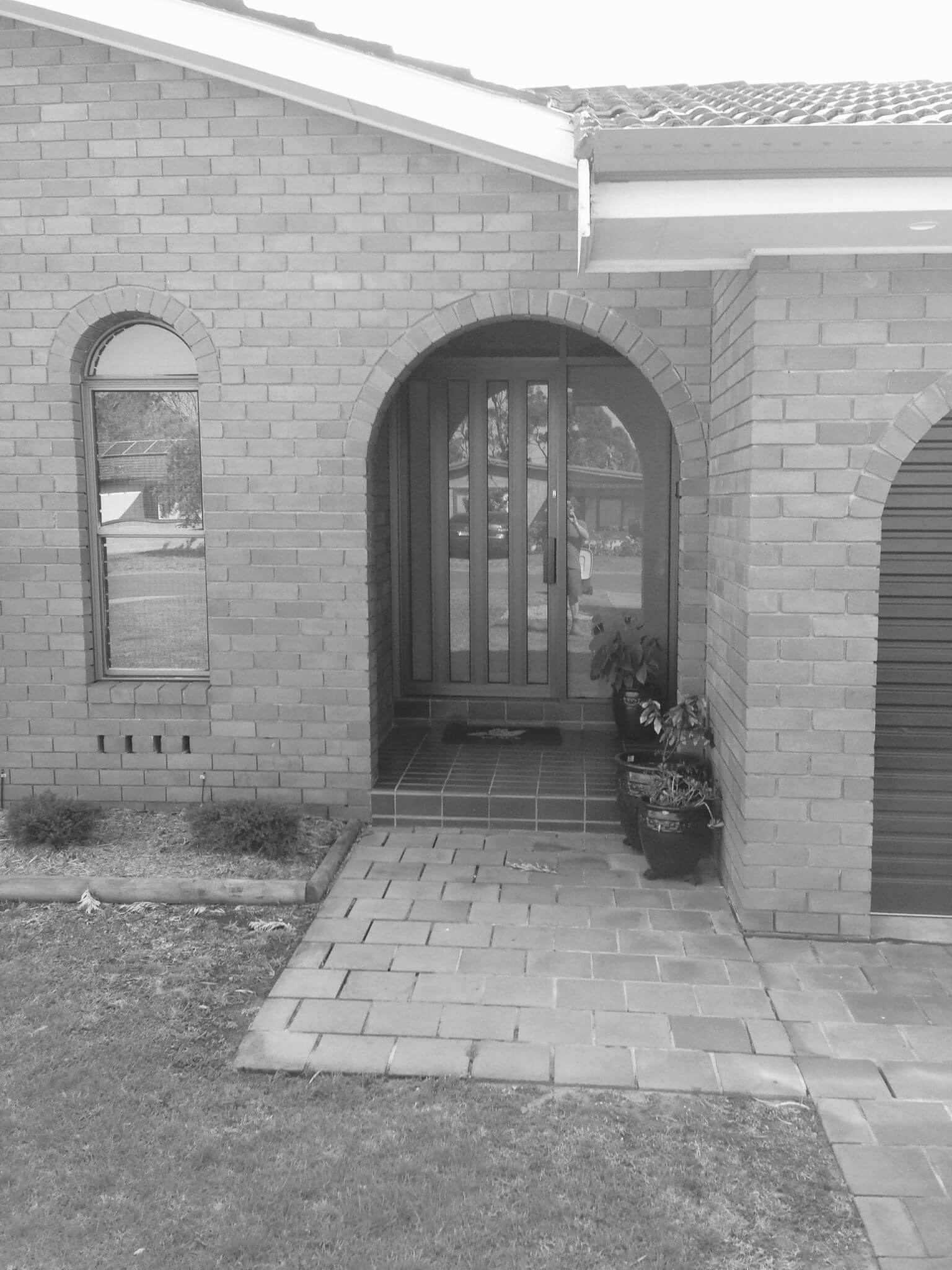 A Modern Door With Security Hinges — Clearshield Security Screens in Bomaderry, NSW