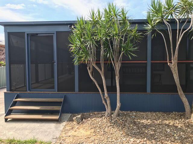 Black Coloured Door Screen Around Deck — Clearshield Security Screens in Bomaderry, NSW
