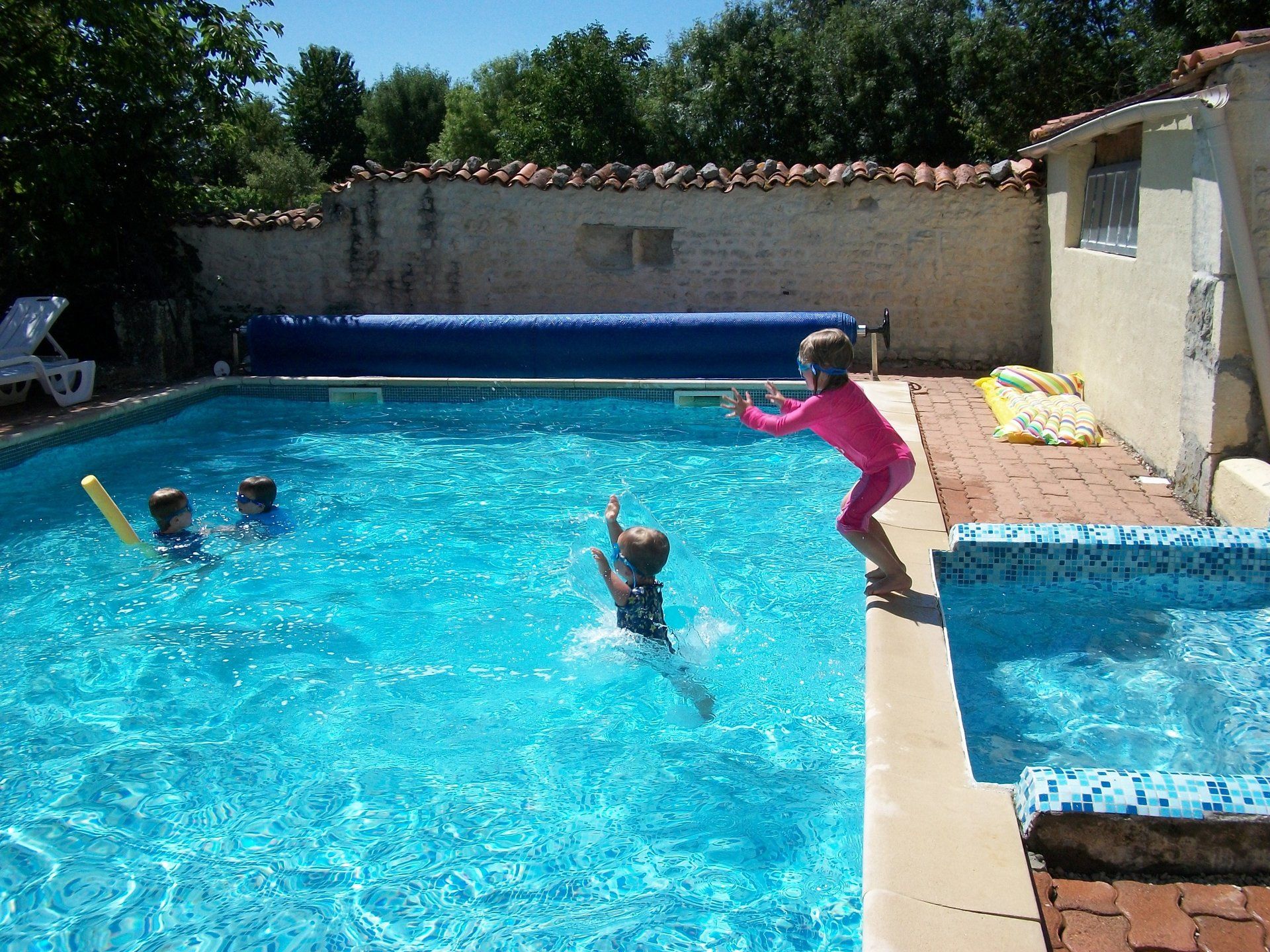 children playing in a swimming pool
