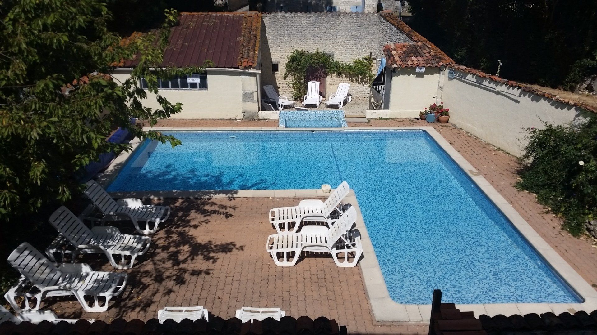 view of L shaped heated pool from above