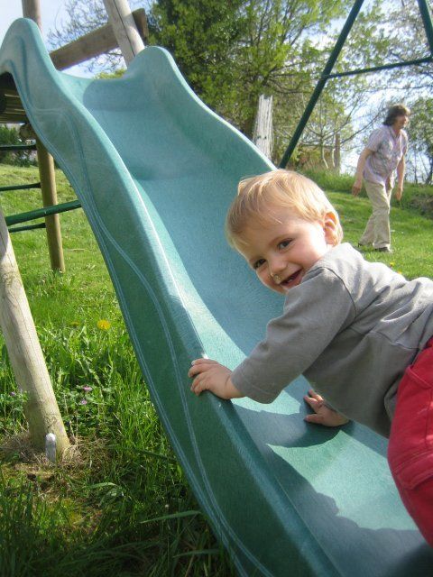 a toddler on a slide