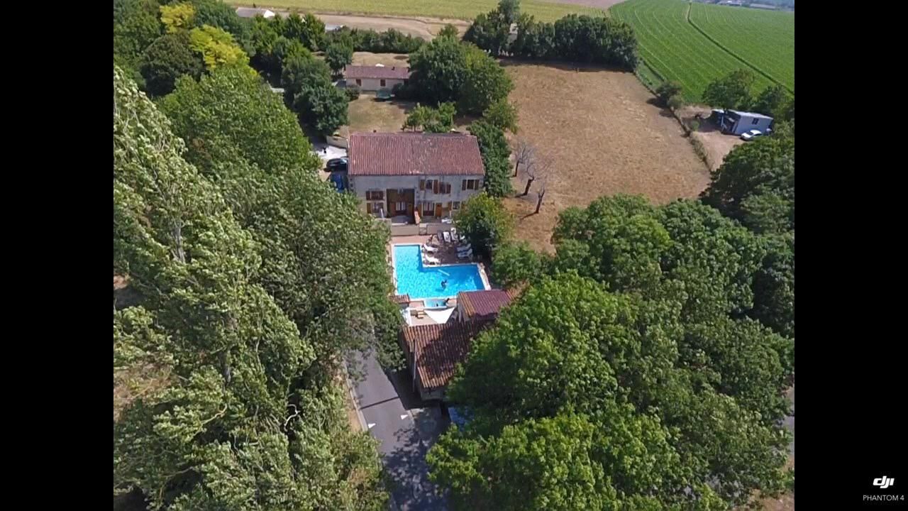 aerial view of French holiday cottages with a pool