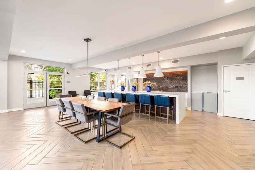 dining table next to a large island with seating