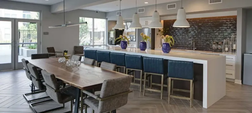 dining table next to a large island with seating