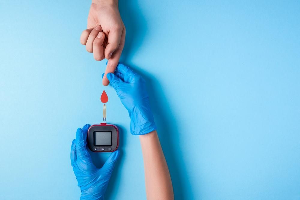 a Man's Hand Taking a Blood Test — Warners Bay Pharmacy In Warners Bay, NSW