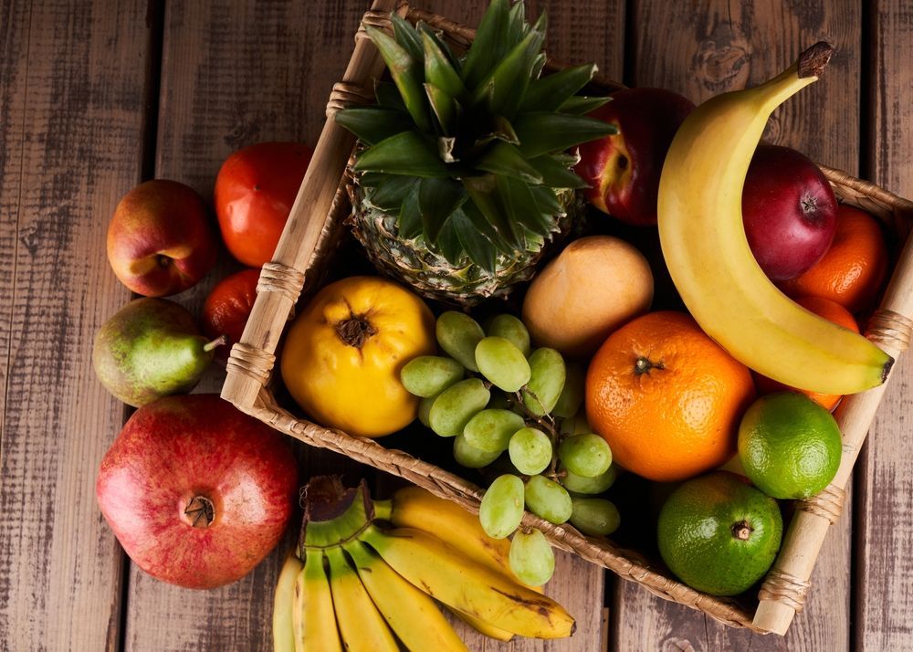 a Wooden Box Filled With Fruit on a Wooden Table — Warners Bay Pharmacy In Warners Bay, NSW