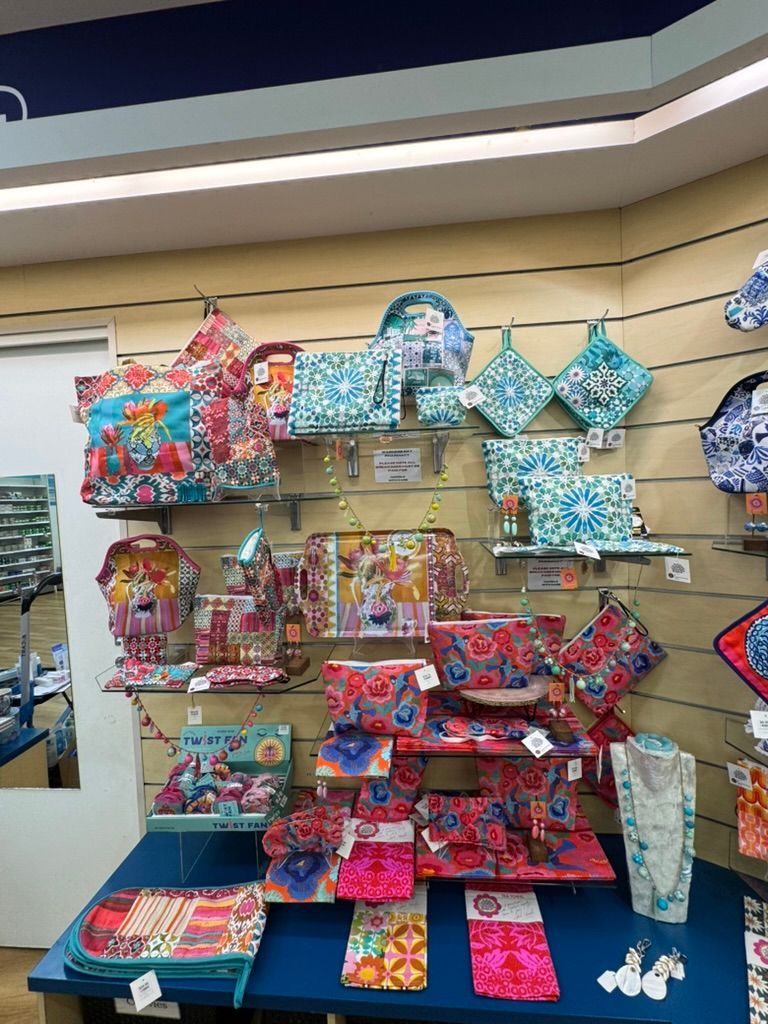 a Striped Clutch With a Bonus Beach Clutch — Warners Bay Pharmacy In Warners Bay, NSW