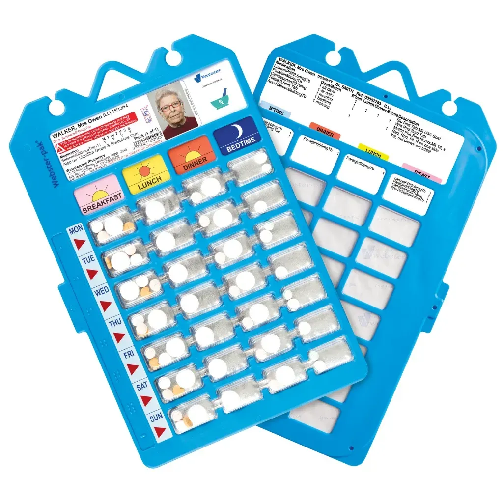 a Weekly Pill Organizer Filled With Pills and Capsules on a Table — Warners Bay Pharmacy In Warners Bay, NSW