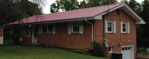 Residential house with red roofing - roofing in Bristol, TN