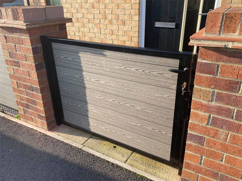 Composite garden gate with black charcoal frame