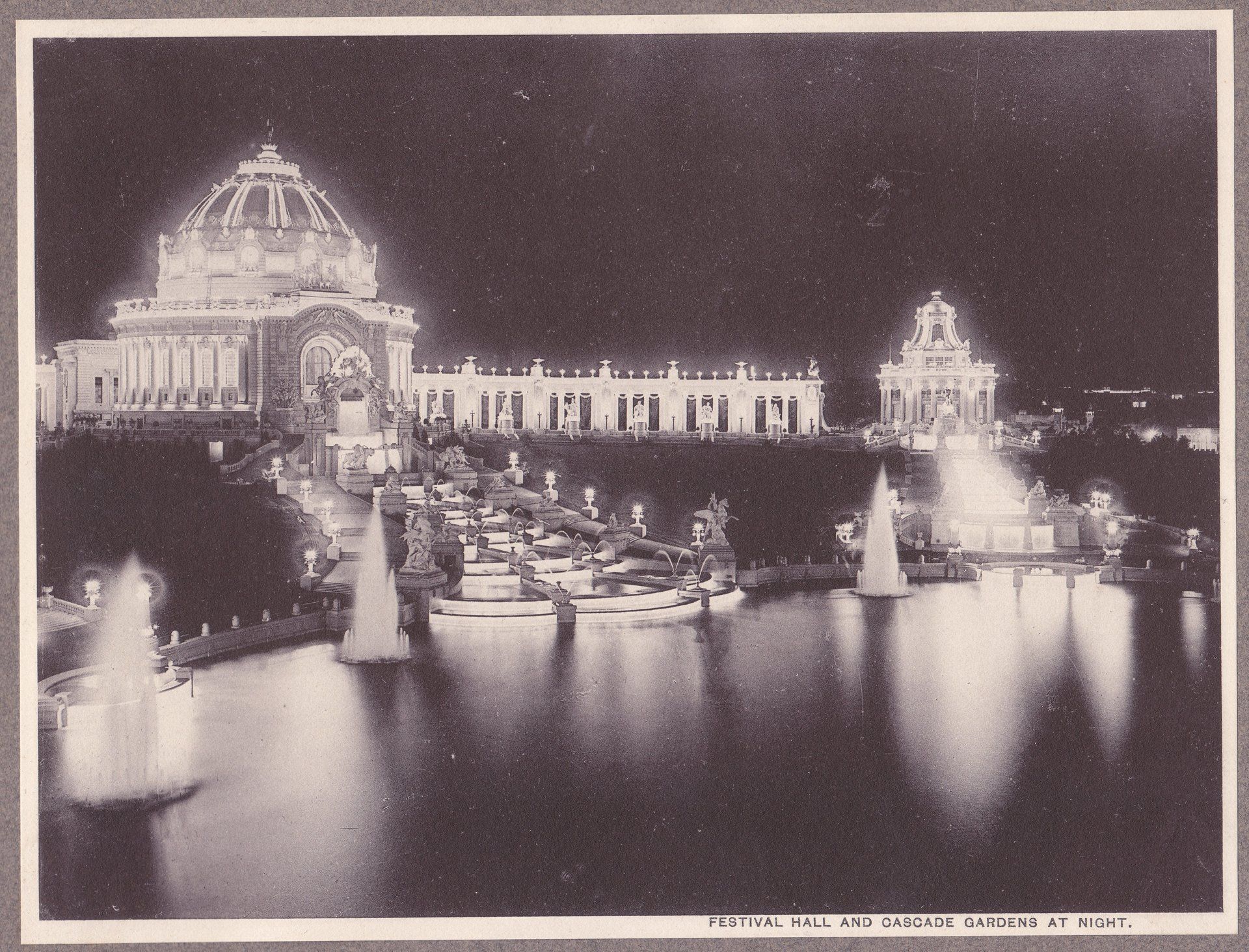 FESTIVAL HALL AND CASCADE GARDENS AT NIGHT.