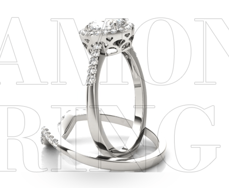 A couple of wedding rings sitting on top of each other on a white background.