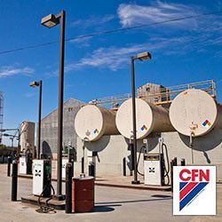 A gas station with a lot of tanks and a CFN logo.