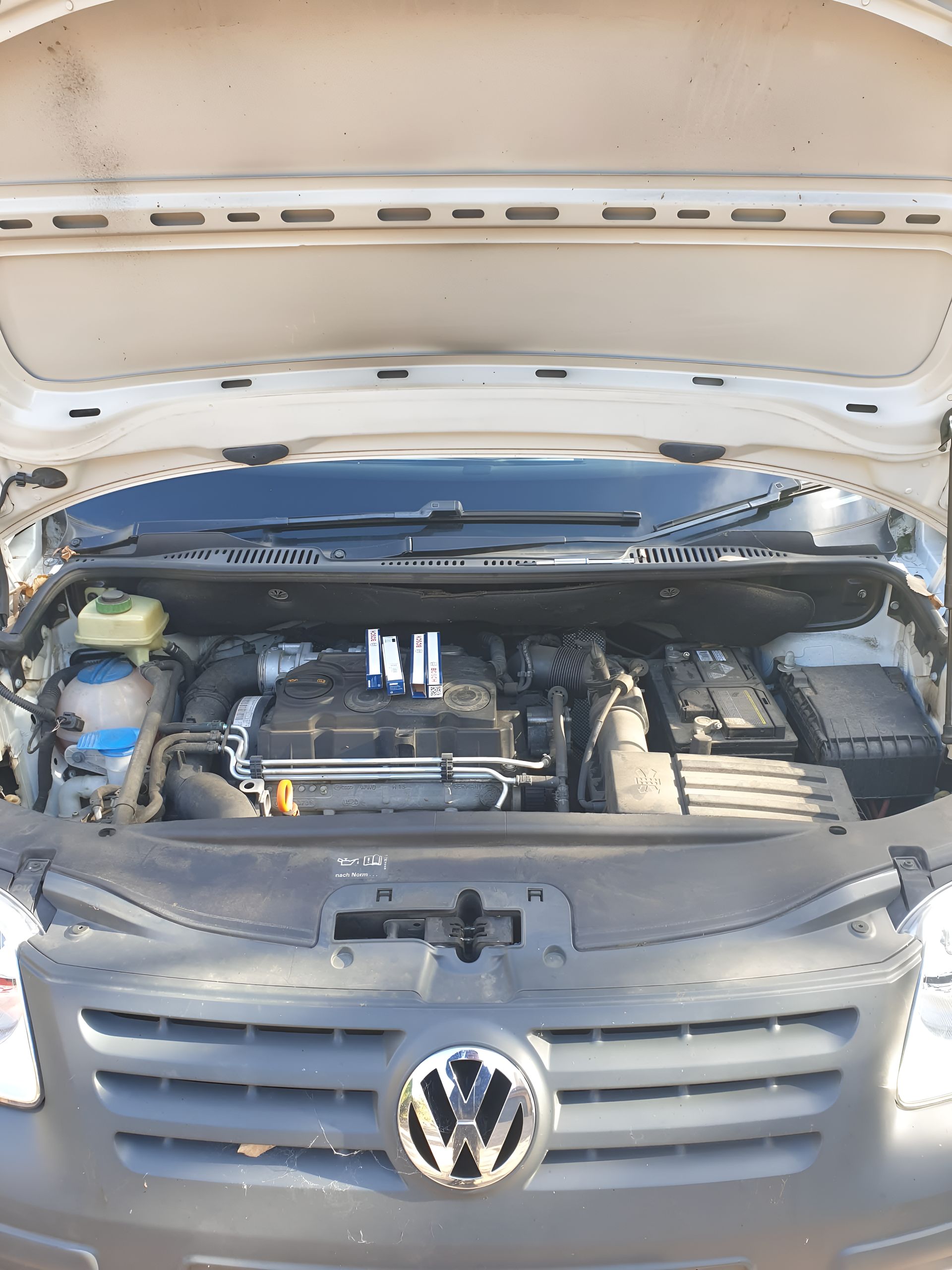 The Hood of a Volkswagen is Open and Shows the Engine — Practic Automotive Services In Austinmer, NSW