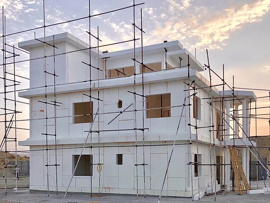 A house is being built with scaffolding around it.