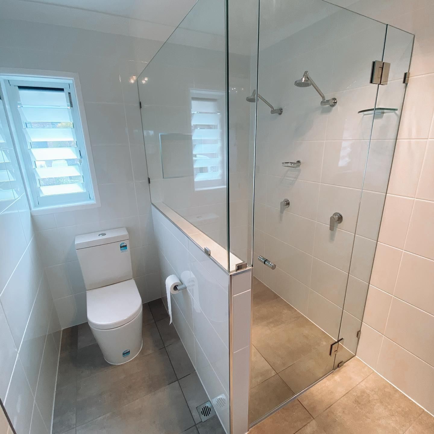 A Bathroom with A Toilet and A Walk in Shower — Distinctive Glass In Toormina, NSW