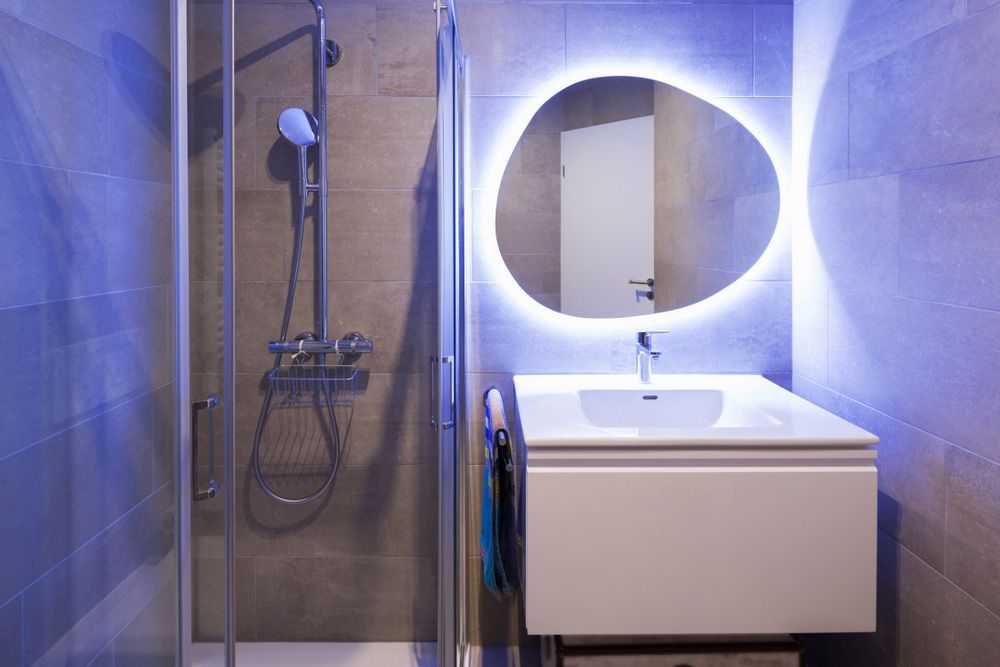 A Bathroom with A Sink, Shower, and Mirror — Distinctive Glass In Taree, NSW