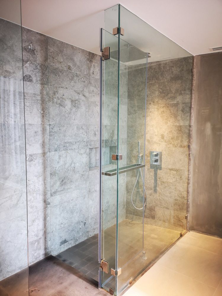 A Bathroom with A Walk in Shower with A Glass Door — Distinctive Glass In Toormina, NSW