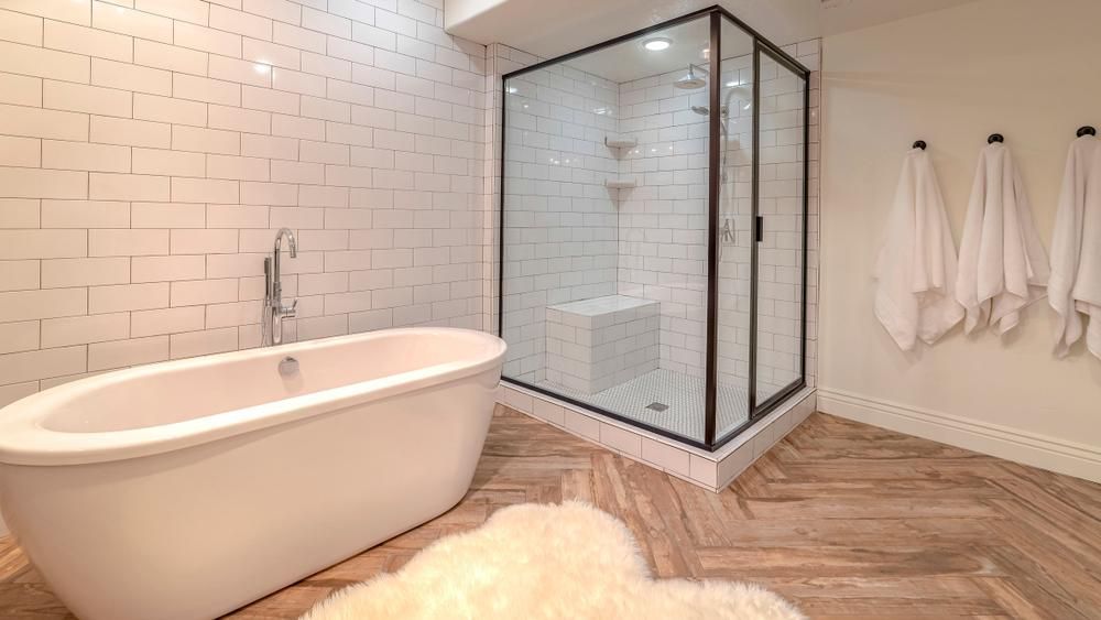 A Bathroom with A Bathtub and A Walk in Shower — Distinctive Glass In Taree, NSW