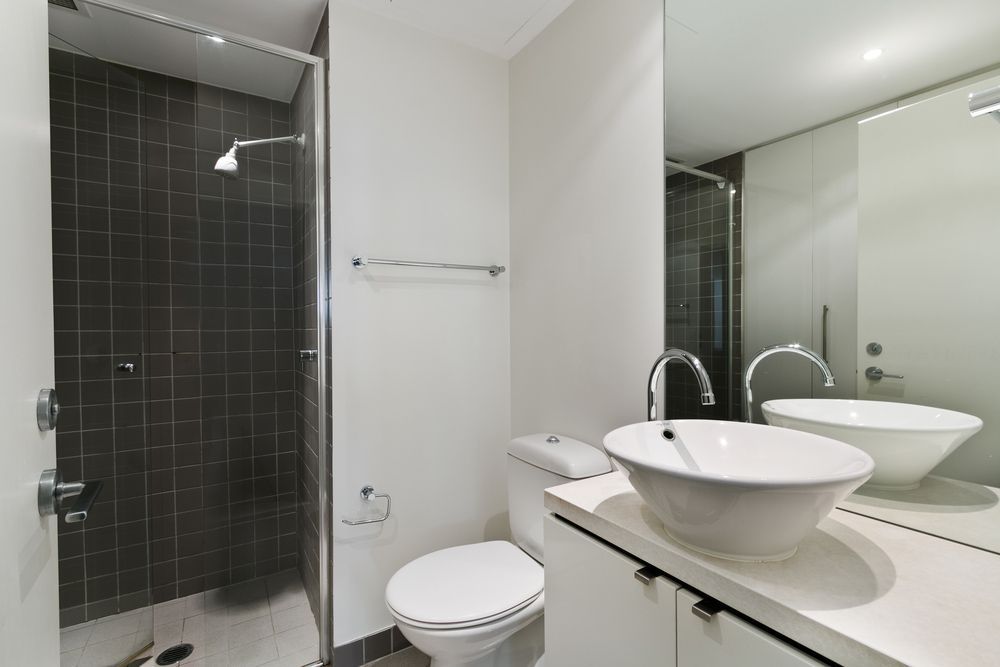 A Bathroom with A Sink, Mirror and Walk in Shower — Distinctive Glass In Toormina, NSW