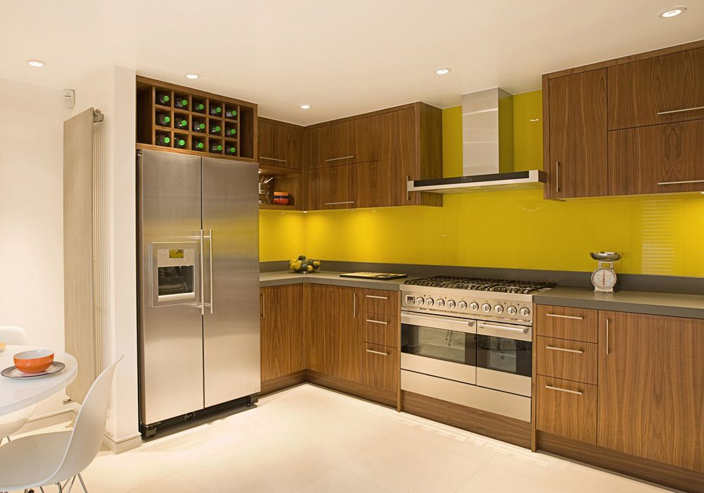 A Kitchen with Stainless Steel Appliances and Wooden Cabinets — Distinctive Glass In Taree, NSW
