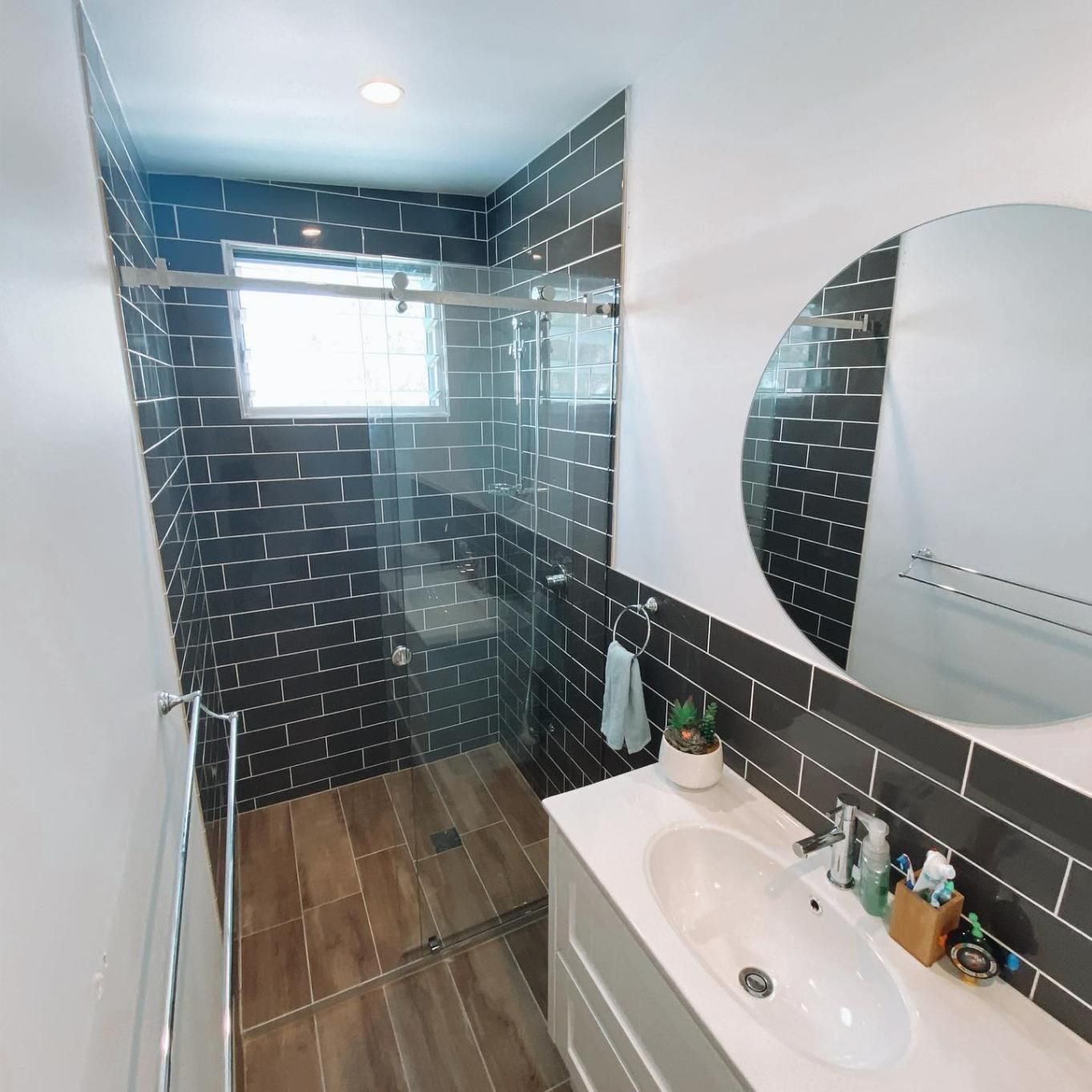 A Bathroom with A Sink a Mirror and A Walk in Shower — Distinctive Glass In Nambucca Heads, NSW