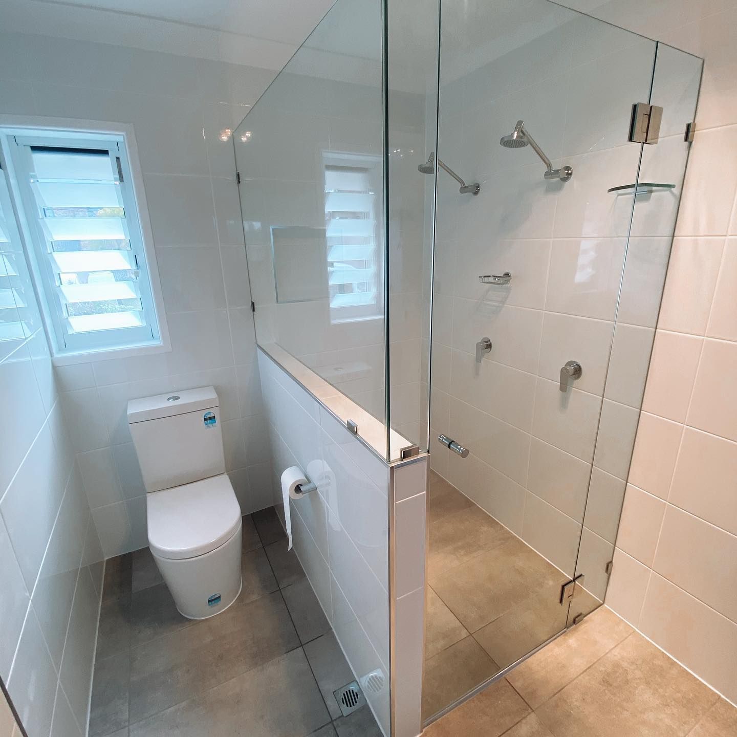 A Bathroom with A Toilet and A Walk in Shower — Distinctive Glass In Kempsey, NSW