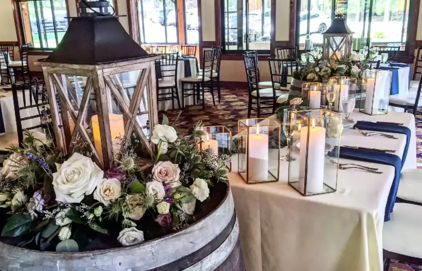 A table with candles and flowers on it in a room.