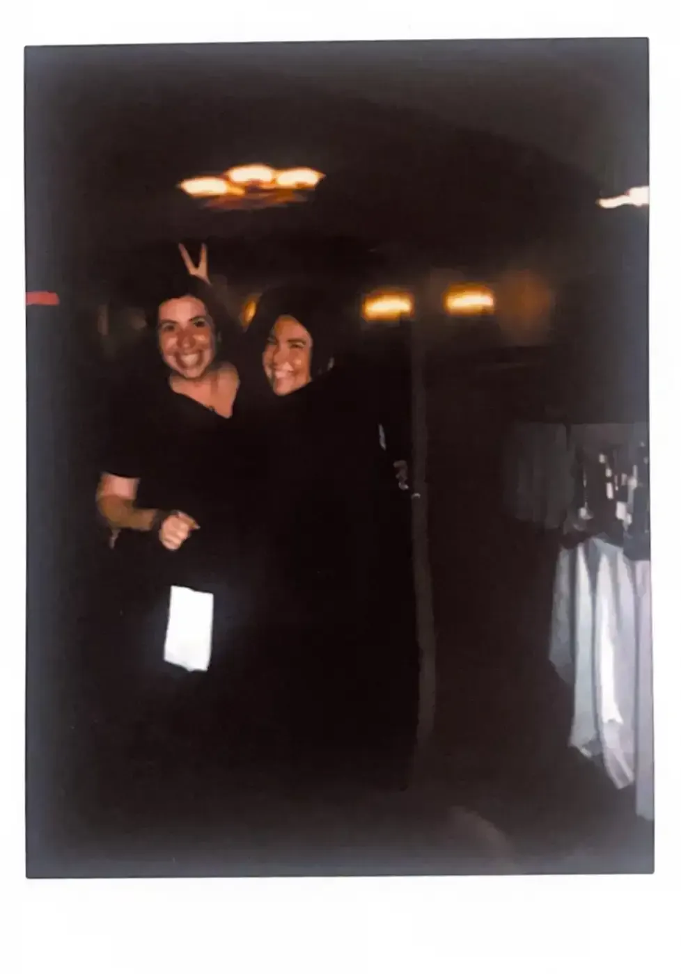 A black and white photo of two people standing next to each other