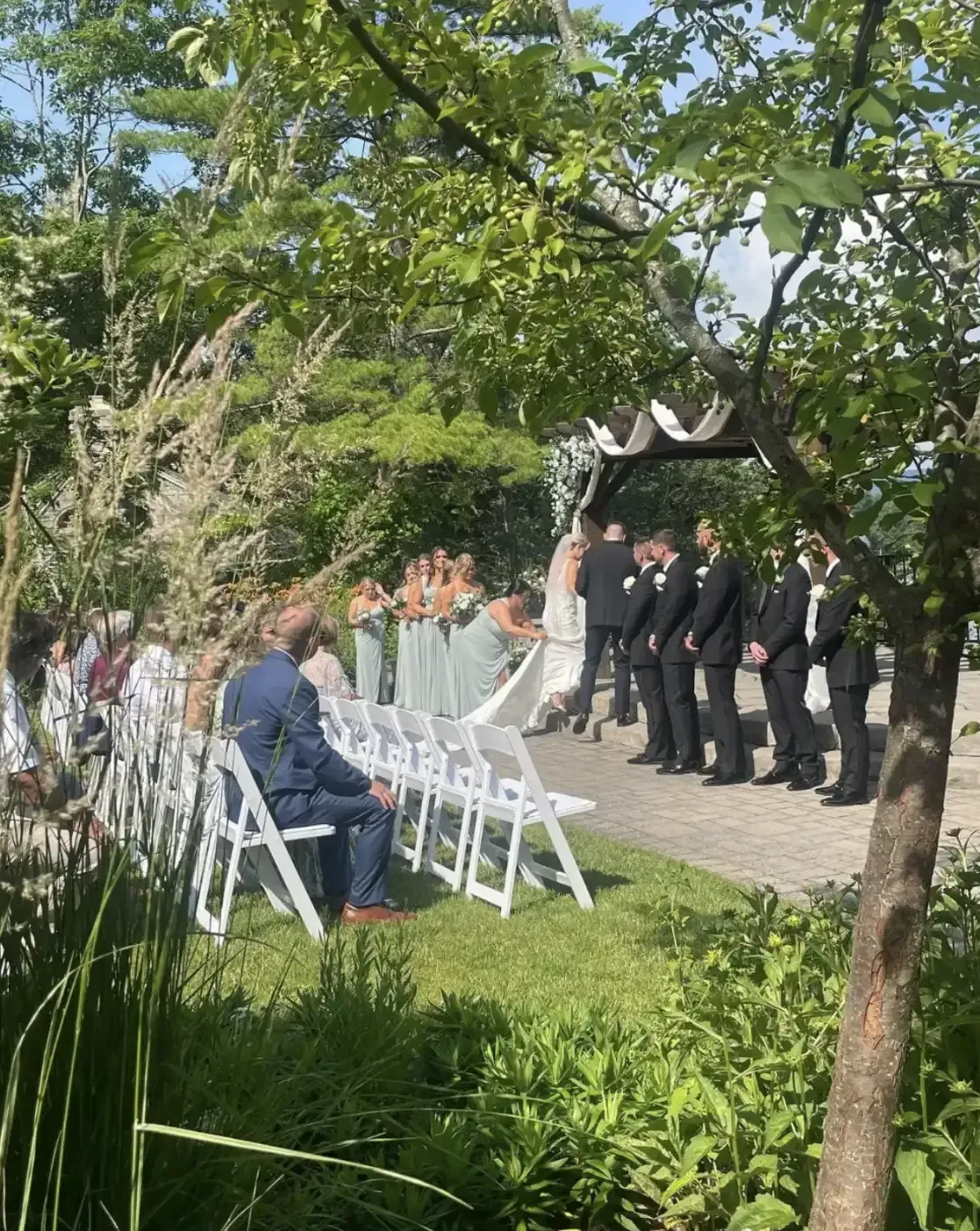 A bride and groom are walking down the aisle at a wedding ceremony.