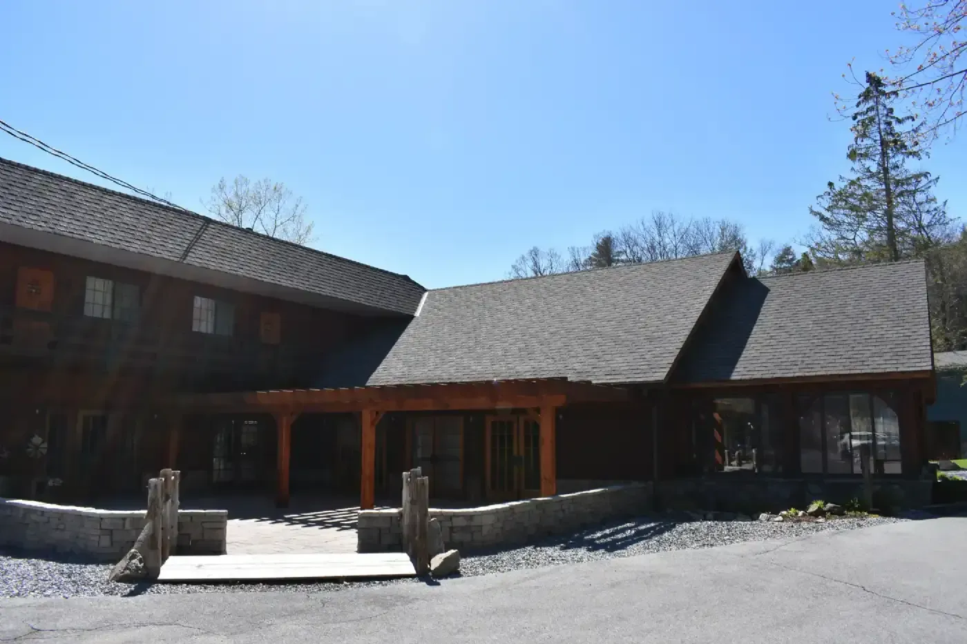 A large house with a lot of windows and a gray roof